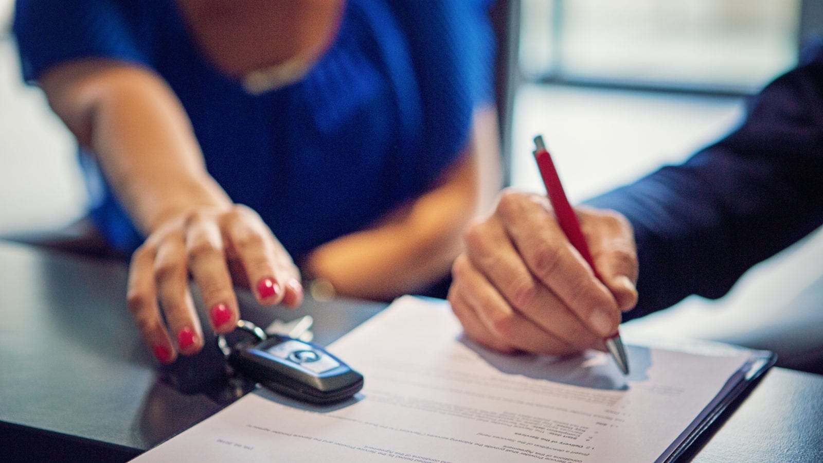 Couple Leasing A Car From A Car Dealer Stock Photo