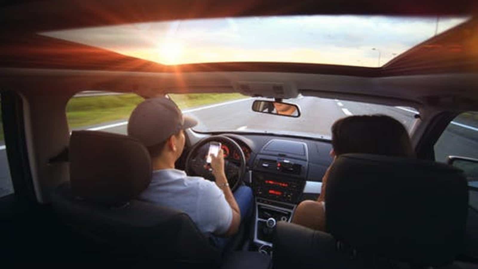 Couple Texting While Driving Stock Photo