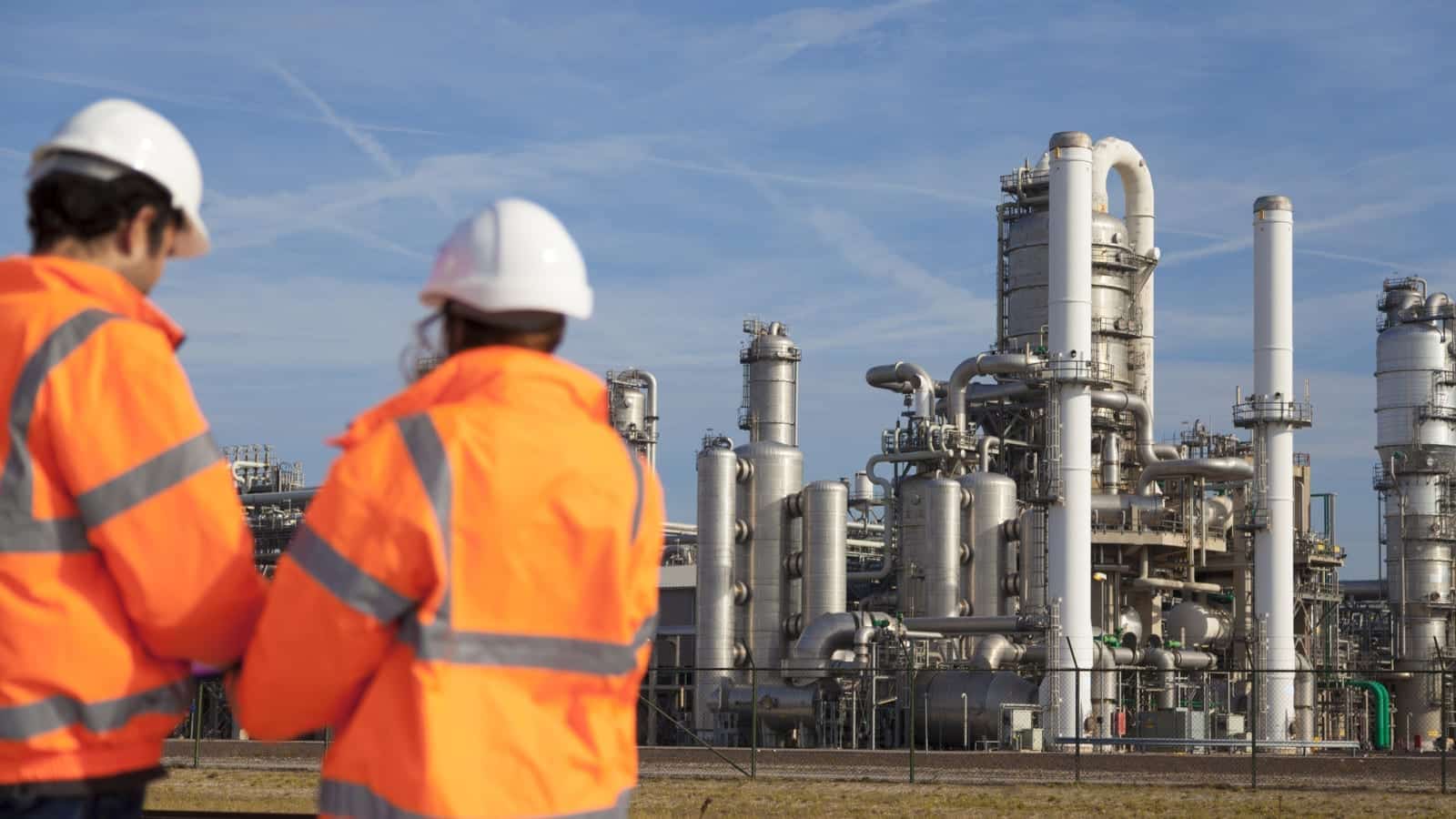 Oil And Gas Plant Workers Stock Photo