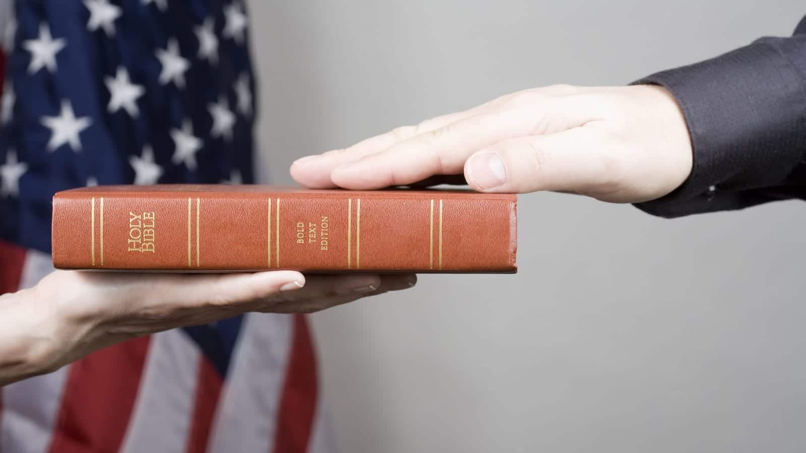 Man Swearing On A Bible Stock Photo