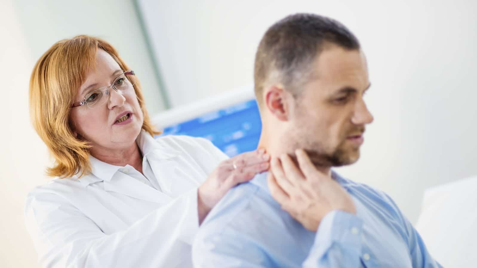 Man Experiencing Neck Pain After A Car Accident Stock Photo