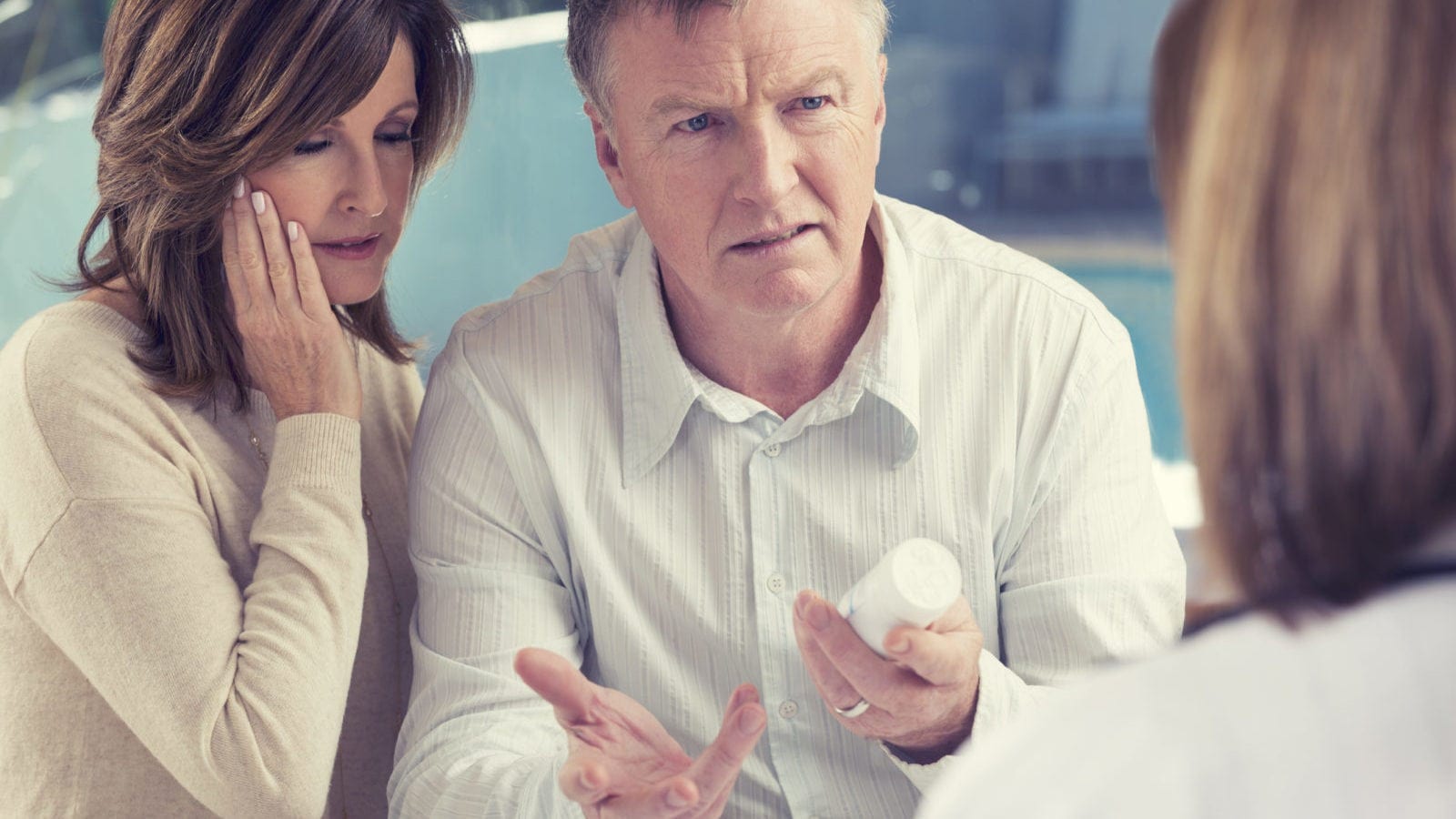 Mature Couple Meeting With Doctor Privately Stock Photo