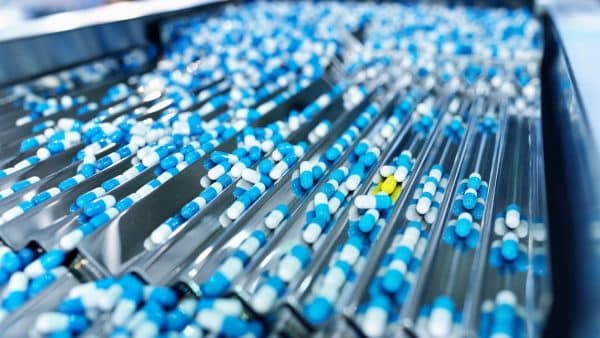 Prescription Pills Being Bottled Stock Photo