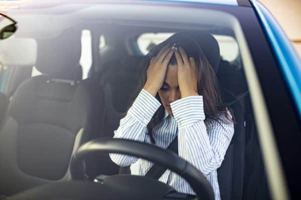 A woman sitting in her car after an accident in Chattanooga, TN.