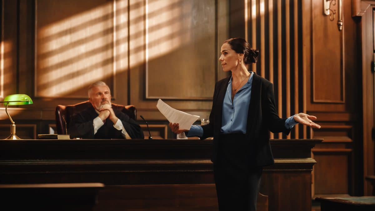 An experienced car accident trial attorney presents a case to a jury in a courtroom.